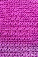 Rosa tricotado tecido Como uma fundo. fechar-se. textura foto