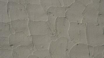 fundo do concreto parede textura e detalhe rude grão do espátula reboco em superfície foto