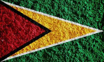bandeira do cooperativo república do Guiana em uma texturizado fundo. conceito colagem. foto