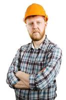 trabalhador com capacete laranja e camisa xadrez foto
