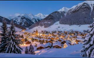 ai gerado inverno país das maravilhas, encantador alpino Vila coberto dentro neve, iluminado de cintilante luzes foto