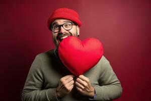 ai gerado retrato do uma feliz homem com uma vermelho coração em dia dos namorados dia conceito. foto