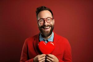 ai gerado retrato do uma feliz homem com uma vermelho coração em dia dos namorados dia conceito. foto