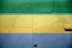 Gabão bandeira retratado em lado parte do militares blindado helicóptero fechar-se. exército forças aeronave conceptual fundo foto