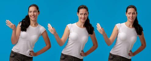 lindo mulher dentro uma branco casual camiseta posando contra uma azul estúdio fundo. foto