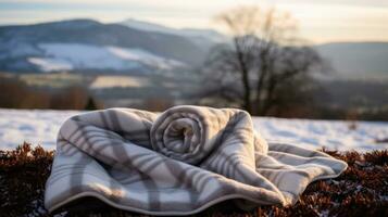 ai gerado uma fofo cobertor e uma quente água garrafa com uma inverno panorama dentro a fundo foto