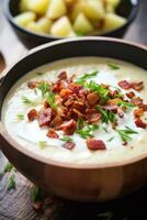 ai gerado uma cremoso e reconfortante batata sopa com bits do crocantes bacon e uma montão do azedo creme em topo foto