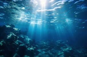 ai gerado água superfície com luz solar debaixo uma azul oceano foto