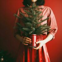 ai gerado uma mulher segurando uma pode segurando uma Natal árvore foto