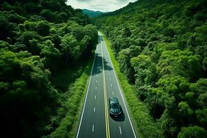 ai gerado aéreo Visão do uma estrada dentro a meio do a floresta foto