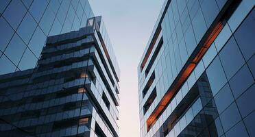 ai gerado dois moderno edifícios com vidro janelas. arquitetura Projeto do edifícios. ai gerado foto