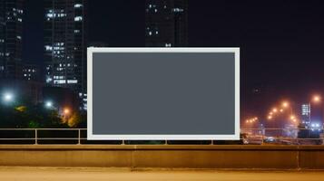 ai gerado Painel publicitário brincar com em branco frente, realista em uma brincar modelo dentro uma rua do noite grande cidade foto