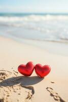 ai gerado dois vermelho corações em a areia contra a fundo do a oceano em uma ensolarado dia foto