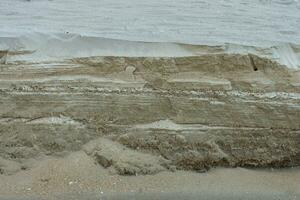 camada do areia às a de praia. foto
