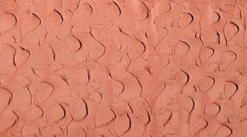 vermelho coral argila gesso paredes, para usar Como uma fundo e textura. foto