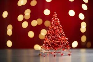 ai gerado vermelho Natal árvore fez acima com papel grampo e fio bokeh borrado fundo cópia de espaço foto