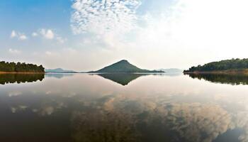 ai gerado majestoso montanha pico reflete dentro tranquilo azul lagoa gerado de ai foto