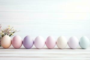 ai gerado feliz Páscoa conceito. espalhados Páscoa ovos dentro pastel cores em uma branco mesa. generativo ai foto