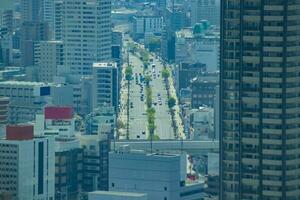 uma Alto ângulo paisagem urbana perto a rodovia dentro Osaka foto