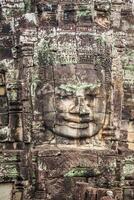 rostos do antigo Bayon têmpora às Angkor o que, siem colher, Camboja foto