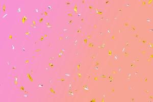 confete de mosca cintilante prata dourada em fundo rosa-laranja. efeito de feriado foto