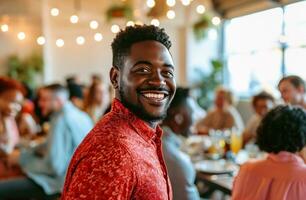 ai gerado uma homem em pé com uma sorrir dentro uma vermelho camisa de uma mesa do pessoas foto