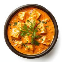 ai gerado cremoso paneer manteiga Masala - indiano prato isolado em branco, topo Visão clipart foto