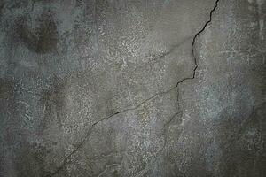 parede de cimento de concreto com uma rachadura para design e textura de fundo