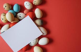 ai gerado uma branco papel e alguns colori ovos em uma vermelho fundo foto