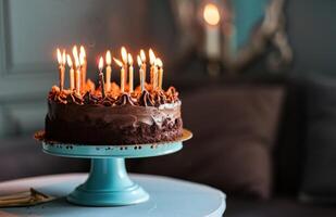 ai gerado uma chocolate aniversário bolo com aceso velas em isto sentado em uma azul ficar de pé foto