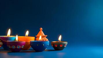 ai gerado feliz diwali - argila diya lâmpadas aceso em azul fundo durante diwali celebração, neural rede gerado fotorrealista imagem foto