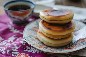 ai gerado núcleo de fazenda fusão maçã e doce batata dorayaki em folk pano foto