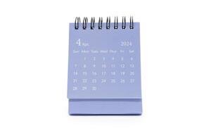 simples azul escrivaninha calendário para abril 2024 isolado em branco fundo. calendário conceito com cópia de espaço foto