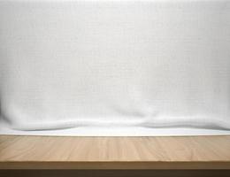 mesa de madeira com fundo de tecido de algodão branco foto