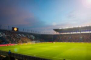 embaçado estádio fundo às crepúsculo. foto