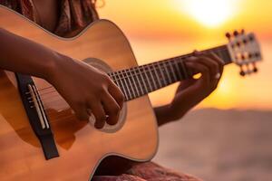 ai gerado africano americano pessoas mãos jogando acústico guitarra em arenoso de praia às pôr do sol tempo. jogando música conceito, neural rede gerado fotorrealista imagem foto