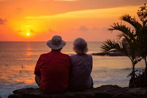 ai gerado silhueta do a idosos casal esperando para uma colorida pôr do sol sentado de a oceano foto