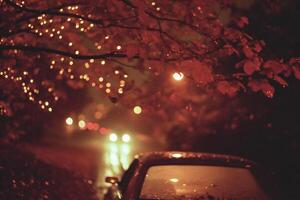 ai gerado carro em a estrada às noite dentro a chuva, desfocado luzes foto