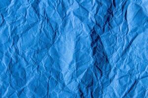 amassado azul papel textura fundo. enrugado papel superfície para projetos. foto