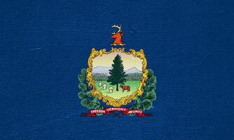 bandeira do Vermont EUA Estado em uma texturizado fundo. conceito colagem. foto