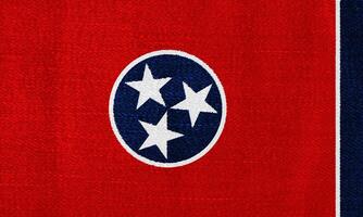 bandeira do Tennessee Estado EUA em uma texturizado fundo. conceito colagem. foto