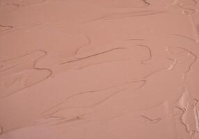 Maquiagem base creme borrão, vermelho argila mascarar textura. fundo foto