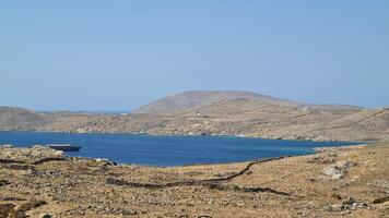 Delos ilha, uma jóia dentro a egeu mar, detém rico mitológico e arqueológico significado foto