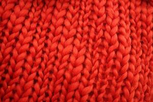 vermelho tricotar suéter fechar-se textura foto