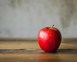 ai gerado uma vermelho maçã sentado em topo do uma de madeira mesa foto