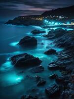 ai gerado a cornish costa bioluminescente mar. livre baixar foto
