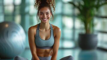 ai gerado uma mulher dentro roupa de esporte senta em uma fitball e sorrisos e parece às a Câmera foto