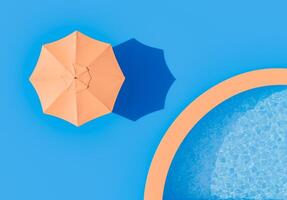 minimalista à beira da piscina Visão com laranja guarda-chuva foto