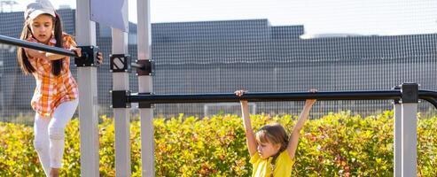 crianças tendo Diversão em a Parque infantil foto