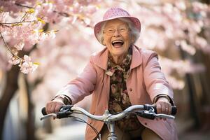 ai gerado feliz sorridente Senior mulher equitação uma bicicleta através uma parque com Rosa cereja flores foto